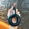 Llavero con Anillo de Silicona para Agarre de Neumático Equipo de Entrenamiento Manual Multilibras Alivio del Estrés Fortalecedor de Agarre Portátil Colgante Venta al por Mayor