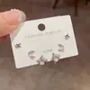 Moda Coreana y Japonesa Versátil para Viajes Diarios Estrella Luna Aretes de Botón de Tres Piezas Combinación de Aretes de Diseño Elegante y Sencillo Venta al por Mayor