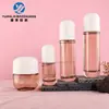 Juego de botellas de vidrio cilíndricas en stock de 30-120 ml para agua, loción y esencia, frascos vacíos de 50g y 100g para crema facial, materiales de embalaje