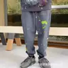 Pantalones Largos Casuales Unisex con Estampado de Letras Logo y Cordón Estilo Básico Tinta Salpicada Ropa de Pareja