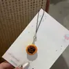Tarta de Huevo de Chocolate Mochila Escolar Colgante Pequeño Divertido Comida Artificial Llavero Colgante para Mochila Escolar Estudiante Accesorios Lindos