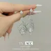 Pendientes Largos de Pluma Plateada Moda Francesa 2025 Nuevos Pendientes de Lujo Accesible de Alta Gama Diseño Elegante Pendientes