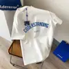 Venta al por mayor Exportación Pareja Manga Corta Holgada Elegante Camiseta Estilo Hong Kong Estampado de Oso Fresa Verano Nuevo Camisa de Media Manga