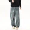 Jeans masculino casual, moderno, versátil, com cordão, cintura totalmente elástica, perna reta, solto, para o outono/inverno de 2026