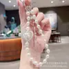 Cadena de Teléfono Móvil de Bola Bordada con Lazo de Gama Alta Ins Lujo Exquisito Cristal Versátil Colgante de Estrella de Playa Cadena Colgante