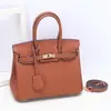 Bolso de Lujo Togo de Piel de Vaca de Grano Fino Platino Cuero Genuino Moda Bolso de Hombro y Mano Textura Exportación Transfronteriza Bolso Kelly