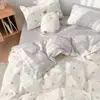 Conjunto de cama minimalista estilo Nantong de quatro peças, adequado para todas as estações, feito de algodão com estampa reativa