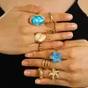 Anillo de combinación de flor de perla barroca transfronteriza europea y americana para mujer, anillo de lava de metal plisado de moda retro.