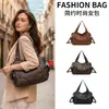 Bolso de Hombro Texturizado de Color Sólido de Comercio Exterior 2026 Nuevo Estilo Otoño de Moda Gran Capacidad Simple para el Trabajo Cruzado a Mano
