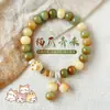 Nuevo brazalete de raíz de bodhi con forma de gato quemado al carbón estilo chino, lindo y de nicho para que jueguen los estudiantes, brazalete decorativo de pata de gato de bodhi para mujeres
