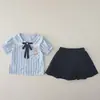 Conjunto de camisa com gola de laço para meninas no verão de 2026, conjunto de duas peças da moda com vestido e shorts de verão para meninas pequenas