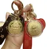 Oro Puro 999 Amarillo Dios de la Riqueza Disco Colgante de Oro Llavero Cadena de Teléfono Decoración para Bolso Venta al por Mayor para Hombres y Mujeres