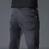 Jeans retro de alta gama para hombre, pantalones rectos de corte ajustado, pantalones versátiles elásticos de marca de moda, nuevo modelo primavera 2026