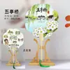 Venta al por mayor de fábrica Yangzhou lugar escénico wenchuang pintura flotante reloj de pared para fichar recuerdo turístico abanico de papel de arroz con borla