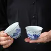 Taza de té vintage azul y blanco, taza invertida, cerámica Dehua, diseño de paisaje, uso doméstico, juego de té kung fu, taza para invitados, venta al por mayor de fabricante