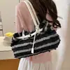 Bolso de mezclilla para mujer, nuevo de 2026, moda casual de primavera, bolso de hombro versátil, bolso tote de gran capacidad para el día a día