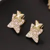 Pendientes de Estrella de Cuatro Puntas de Moda Ligeramente Lujosos Transfronterizos Europeos y Americanos, Pendientes Retro Versátiles de Gama Alta Sencillos para Mujer