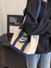 Bolsa de lona para cesta de verduras de color contrastante con bordado de letras casuales europeas y americanas, nueva bolsa de hombro portátil con textura retro 2023