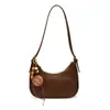Bolso retro bajo el brazo para mujer, nuevo y versátil bolso de hombro y cruzado de alta gama, moderno diseño de nicho, bolso de mujer con forma de media luna