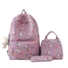 Mochila de dibujos animados para estudiantes, estilo coreano versátil, mochila de campus para estudiantes de primaria, ligera de nailon, mochila escolar de tres piezas