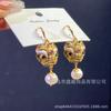2023 nuevo estilo chino retro Xingshi gancho para la oreja de perla natural femenino micro incrustado aretes de circonita aretes elegantes de moda