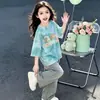 Ropa Infantil Degradada Verano 2026 Nueva Camiseta para Niñas Dibujos Animados Linda Casual Diaria Manga Corta Top Algodón Puro