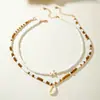 Nuevo Collar Colgante de Concha de Estrella de Mar de Doble Capa Estilo Bohemio con Perlas de Arroz Cadena para Clavícula de Mujer Vacaciones en la Playa