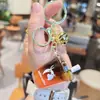 Luckin Coffee Mini Naranja C Americano Botella Arena Líquida Llavero Tendencia de Verano Colgante para Bolso de Pareja Regalo