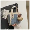 Bolso de mano casual Shuai Mi Jia, bolso tipo cubo simple para mujer, nuevo de verano 2026, estilo coreano, moderno, de nicho, bolso cruzado