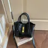 Bolsa de mão de moda estilo coreano, bolsa quadrada pequena, novo modelo outono 2026, bolsa de ombro transversal com padrão trançado casual simples de nicho