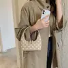 Bolsa de mano estilo coreano con lunares inspirada en la universidad para mujer, nueva colección otoño 2026, moderna y versátil, gran capacidad, bolso de hombro