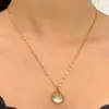 Amazon Transfronterizo Europa y América Moda Semillas de Bolsa de Pastor Collar Ovalado de Deseos Collar de Acero Inoxidable Hombres Mujeres Regalo para Pareja