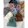 Bolsa de almacenamiento de pana de color liso con cierre de cordón, un juego portátil de tres piezas de gran capacidad y una bolsa de almacenamiento simple
