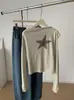 Camiseta off-shoulder de manga longa com estampa de estrela de cinco pontas para mulheres, moda coreana tendência outono 2026