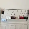 Bolso Cuadrado Pequeño Minimalista de Gama Alta Verano 2026 Nuevo Bolso de Hombro Versátil Hebilla de Cinturón Retro de Nicho Bolso Cruzado de Moda