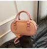 Nova Moda Bolsa de Bowling Primavera e Verão 2025 Bolsa de Mão Simples de Alta Qualidade Bolsa Transversal Versátil Estilosa