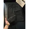 Calça jacquard estilo retrô americano com padrão de losangos, design fino e respirável para o início do outono masculino, com caimento fluido e corte reto solto, perfeita para uso casual