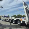 Semirremolque transfronterizo de Asia Central para transporte de ingeniería, semirremolque de plataforma baja de 3 ejes, semirremolque de plataforma plana tipo gancho de 60 toneladas