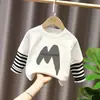 Camiseta base para niño 2026 nuevo modelo camiseta de manga larga a rayas patchwork para niños top de algodón puro otoño para niños mayores