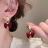 Aretes de botón de lazo flocado rojo festivo retro francés para mujer, aretes sencillos de personalidad que combinan con todo, aretes dulces de Año Nuevo