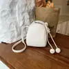 Bolso de mano de color liso muy elegante estilo coreano, nuevo bolso cuadrado pequeño casual estilo coreano de verano 2026, bolso de hombro y cruzado de ins