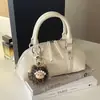 Bolsa de mão personalizada transfronteiriça para uso diário, novo modelo outono 2026, requintada, moderna, elegante, casual, adequada para o trabalho, bolsa de ombro e transversal