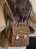 Nuevo modelo de otoño de 2026, mochila única de estilo universitario de alta costura elegante, bolso de hombro de moda nicho para el día a día