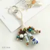 Colgante de bolsa de cuentas de cerámica de Jingdezhen, llavero artístico tejido a mano de semilla de bodhi, adorno colgante de nicho estilo bosque