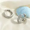 Pendientes de superventas transfronterizos europeos y americanos, cierres de oreja de circonita de cobre, totalmente incrustados de diamantes, adecuados para ir al trabajo, con un toque de lujo ligero y de alta gama, pendientes para mujer