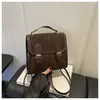 Textura vintage para mujer 2026 estilo universitario británico nueva moda para ir al trabajo diseño simple mochila de un solo hombro cruzada