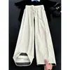 Pantalones deportivos casuales de ajuste limpio con estampado de ondas transfronterizos para hombre, pantalones casuales de verano de pana con un diseño de pierna ancha y caída.