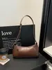 Cuero PU, estilo vintage, diseño de nicho, bolso de hombro bajo el brazo, bolso de mano para mujer, bolso tote simple y casual, bolso urbano en forma de baguette