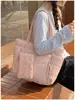 Bolsa de algodón de color liso, simple y elegante, bolso de mano de moda, bolso tote de un solo hombro, para llevar debajo del brazo, nueva versión coreana, primavera 2026