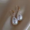 2025 Novo Estilo Quente Brincos de Moda de Luxo Acessível Gancho de Orelha Único e Exquisito Estilo Ins Brincos de Pérola e Zircônia